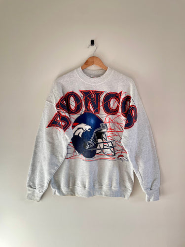 Vintage Denver broncos crewneck - broncos is spelled out largely across the chest with the broncos helmet graphic below 