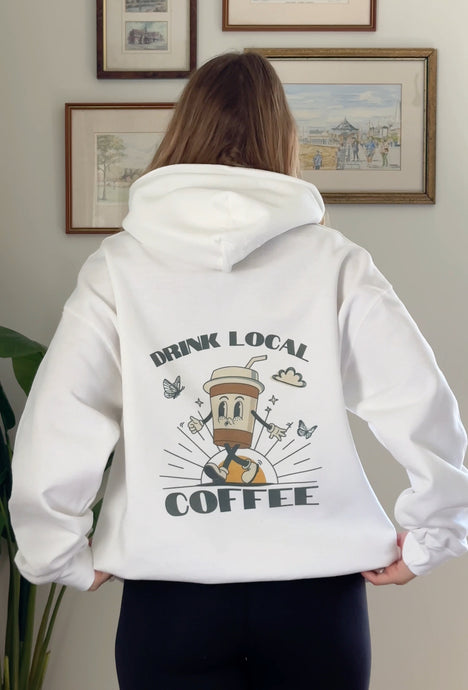 White colored sweatshirt with Drink Local Coffee screenprinted on the back of the sweatshirt with a fun coffee cup logo