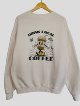 Load image into Gallery viewer, Cream sweatshirt with Drink Local Coffee screenprinted on the back of the sweatshirt with a fun coffee cup logo
