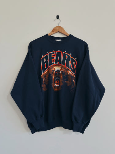 Navy blue sweatshirt with bear graphic and 'BEARS' text on a hanger against a white wall