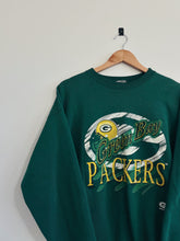 Load image into Gallery viewer, Green Bay Packers sweatshirt on a hanger against a white background
