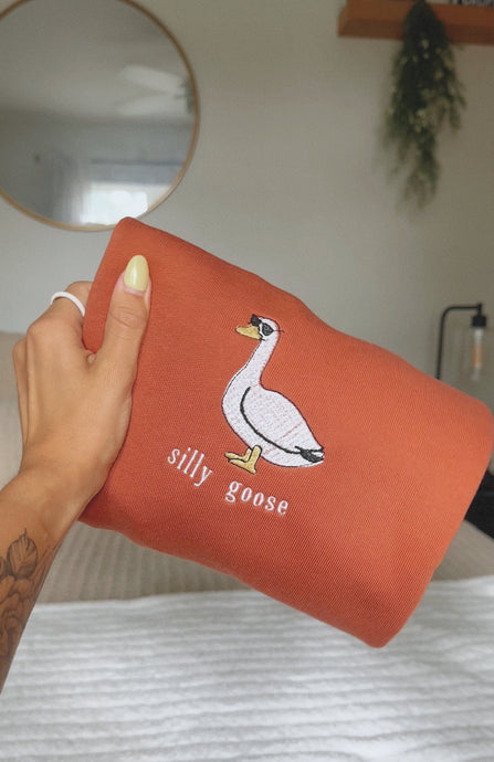 burnt orange silly goose with sunglasses embroidered crewneck