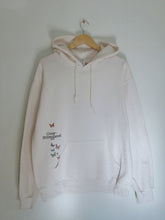 Load image into Gallery viewer, overstimulated hoodie with a butterfly design on the front pocket
