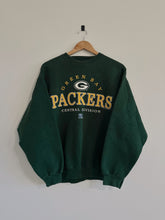 Load image into Gallery viewer, Green Bay Packers sweatshirt on a hanger against a plain background
