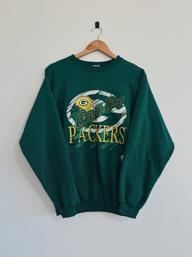 Green Bay Packers sweatshirt on a hanger against a white background
