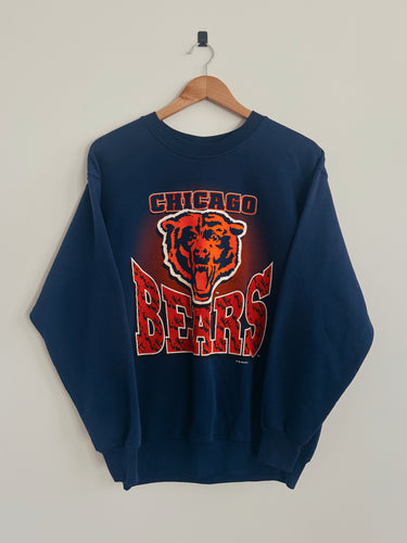 Navy blue sweatshirt with Chicago Bears logo on a wooden hanger against a light gray background